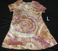 A short-sleeve A-line dress with a brown, pink, and cream agate stone pattern, laid flat on a black background with a white letter 'L' on the right side.