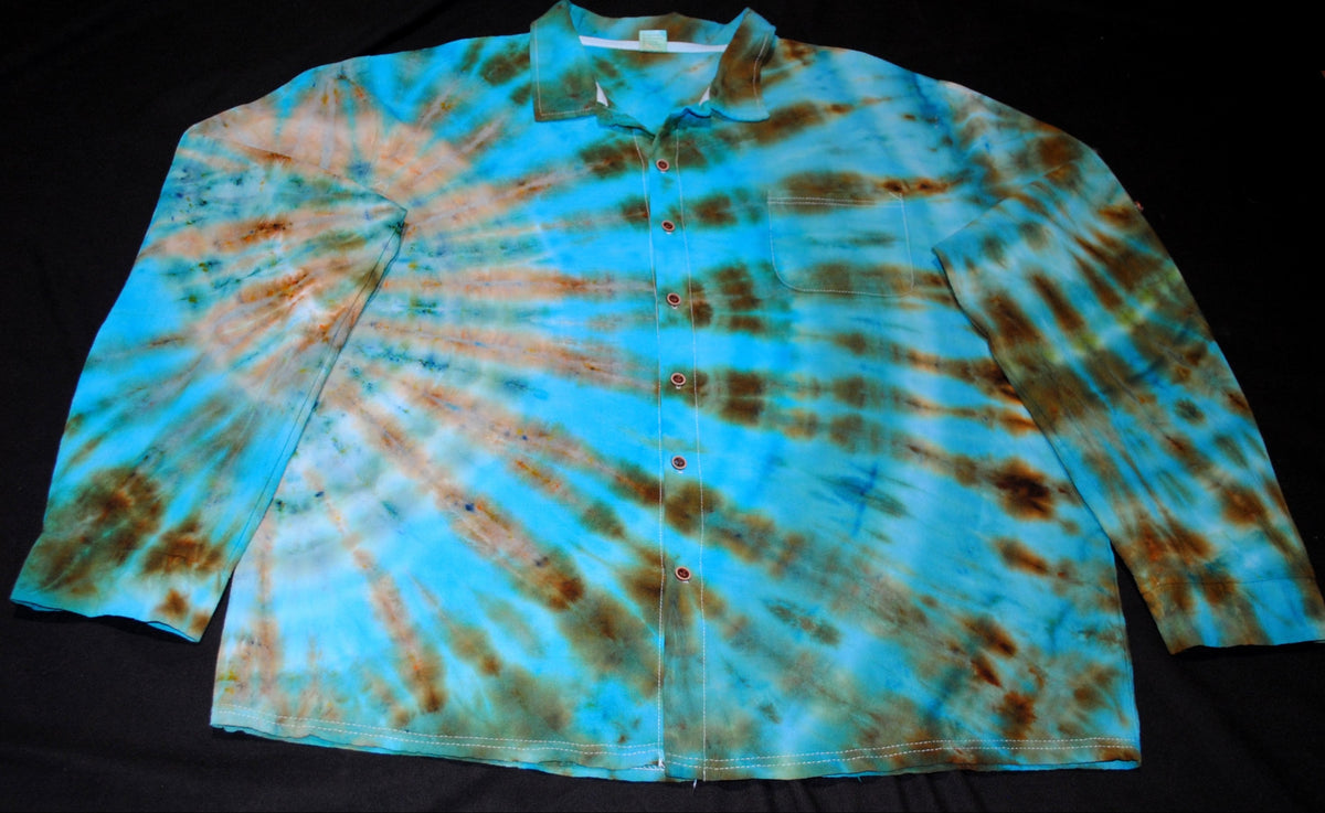 A long-sleeve button-up shirt with a blue and brown tie-dye spiral pattern, laid flat on a black background.