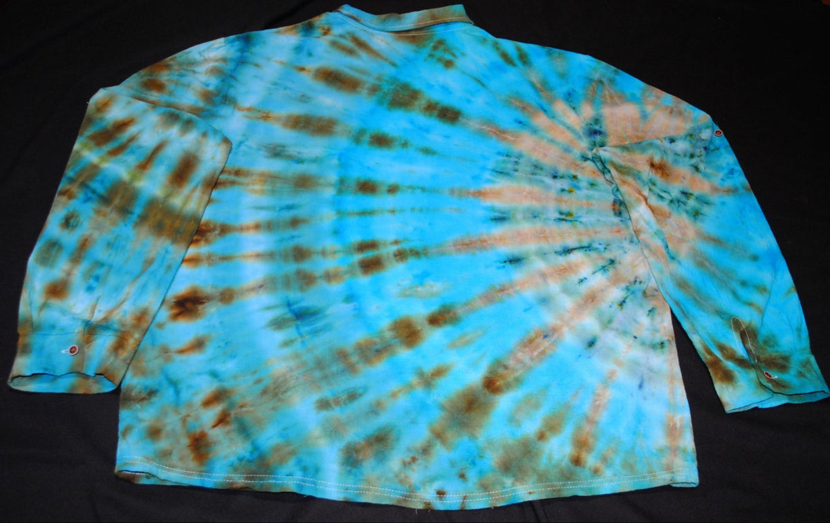 A long-sleeve tie-dye shirt laid flat on a black background, featuring a spiral pattern of turquoise blue, brown, and tan.